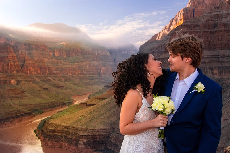 Couple on the Grand Canyon floor during helicopter wedding ceremony