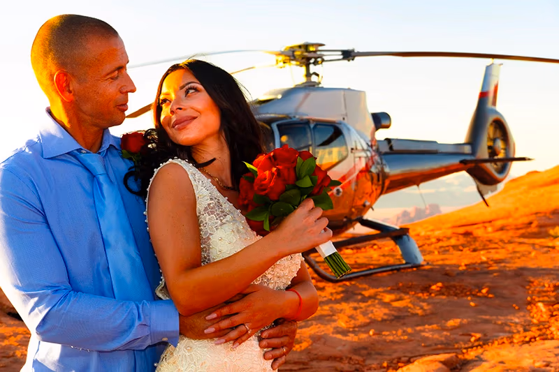 Couple on a red rock peak during Valley of Fire helicopter wedding