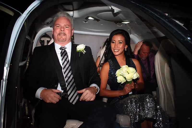 Couple during Las Vegas Strip helicopter wedding night flight